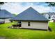 View of backyard featuring a covered patio with comfortable outdoor seating at 328 Brookstone Dr, Carrollton, GA 30116