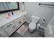 Bathroom with shower/tub combo, modern fixtures and gray wood-look floors at 328 Brookstone Dr, Carrollton, GA 30116