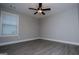 Bedroom featuring new, neutral paint, wood-look floors, and a ceiling fan at 328 Brookstone Dr, Carrollton, GA 30116