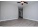 Spacious bedroom with wood-look flooring and fresh paint at 328 Brookstone Dr, Carrollton, GA 30116