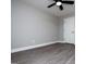 Light grey bedroom with white trim and a ceiling fan at 328 Brookstone Dr, Carrollton, GA 30116