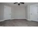Light grey bedroom with white trim, white doors, and a ceiling fan at 328 Brookstone Dr, Carrollton, GA 30116