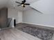 Bonus room with light grey walls, ceiling fan and white door at 328 Brookstone Dr, Carrollton, GA 30116