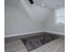 Spacious bonus room with grey walls, grey floors, and a grey rug at 328 Brookstone Dr, Carrollton, GA 30116