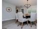 Inviting dining area featuring a round table with six chairs, modern chandelier, and natural light at 328 Brookstone Dr, Carrollton, GA 30116