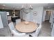 Charming dining room with modern chandelier, round table, and a view to the kitchen at 328 Brookstone Dr, Carrollton, GA 30116