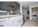 Bright kitchen with stainless steel dishwasher, white cabinetry, and convenient access to the laundry room at 328 Brookstone Dr, Carrollton, GA 30116