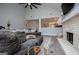 Bright living room with a fireplace, open to kitchen, creating a cozy and connected living space at 328 Brookstone Dr, Carrollton, GA 30116