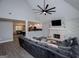 Open concept living room with vaulted ceiling, fireplace, and view of kitchen and dining area at 328 Brookstone Dr, Carrollton, GA 30116