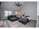 Spacious living room with large gray sectional, vaulted ceilings, and plenty of natural light at 328 Brookstone Dr, Carrollton, GA 30116