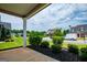 View of the community from the porch with manicured landscaping and neighborhood homes at 328 Brookstone Dr, Carrollton, GA 30116