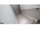 Staircase with neutral paint and gray wood-look flooring at 328 Brookstone Dr, Carrollton, GA 30116