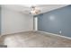 Spacious bedroom with neutral carpeting and a stylish accent wall for a modern look at 4753 Klondike Cv, Lithonia, GA 30038