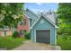 Charming two-story home with a brick and siding exterior, attached garage, well-maintained lawn, and lovely landscaping at 4753 Klondike Cv, Lithonia, GA 30038