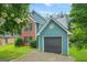 Charming two-story home with a brick and siding exterior, attached garage, well-maintained lawn, and lovely landscaping at 4753 Klondike Cv, Lithonia, GA 30038