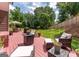 Spacious backyard deck features ample seating, perfect for outdoor entertaining and relaxation in a lush green setting at 130 Bexar Ct, Johns Creek, GA 30022