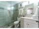 Beautiful bathroom featuring a glass shower with gray tiling and modern fixtures at 130 Bexar Ct, Johns Creek, GA 30022