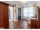 Well-lit dressing area with hardwood floors, a dressing table, and a view to the bathroom and bedroom at 130 Bexar Ct, Johns Creek, GA 30022