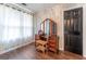 Bright dressing area features hardwood floors, a dressing table with mirrors, and a window for natural light at 130 Bexar Ct, Johns Creek, GA 30022