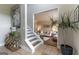 Warm and inviting foyer features a staircase, decorative table, and seamless transition to the adjacent living room at 130 Bexar Ct, Johns Creek, GA 30022