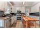Well-lit kitchen with stainless steel appliances, granite countertops, and a unique wooden island at 130 Bexar Ct, Johns Creek, GA 30022