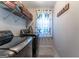 Convenient laundry room with modern washer and dryer set and storage shelving for organization at 130 Bexar Ct, Johns Creek, GA 30022