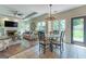 Inviting eat-in area leading to a cozy living room with fireplace and ample natural light at 130 Bexar Ct, Johns Creek, GA 30022