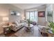 Comfortable living room with a large window, neutral furniture, and a stylish rug creating a cozy atmosphere at 130 Bexar Ct, Johns Creek, GA 30022