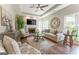Cozy living room with fireplace, hardwood floors and fan at 130 Bexar Ct, Johns Creek, GA 30022