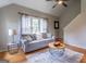 Inviting living room featuring hardwood floors, a comfortable couch, and a stylish rug and tables at 130 Bexar Ct, Johns Creek, GA 30022