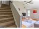 Living room with hardwood floors and neutral decor flows from the stairs for an inviting ambiance at 130 Bexar Ct, Johns Creek, GA 30022