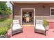 Relaxing outdoor space with comfortable seating overlooking a well-maintained backyard at 130 Bexar Ct, Johns Creek, GA 30022