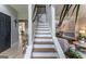 Staircase with wooden steps and white risers leading to the upper level of the house at 130 Bexar Ct, Johns Creek, GA 30022