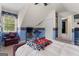 Attic bedroom with playful decor, TV, seating, and ample natural light at 495 Stonehaven Dr, Fayetteville, GA 30215