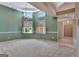 Inviting dining room features bright windows with shutters and elegant chandelier lighting at 316 Kensington Dr, Peachtree City, GA 30269
