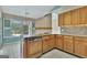 Well-maintained kitchen equipped with granite countertops and wooden cabinetry at 316 Kensington Dr, Peachtree City, GA 30269