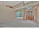 Spacious living room boasts high ceilings, carpet floors, and a view to the dining room at 316 Kensington Dr, Peachtree City, GA 30269