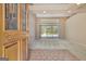 View of an open living area from the front door, featuring a pool view through sliding glass doors at 316 Kensington Dr, Peachtree City, GA 30269