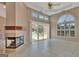 Spacious living area featuring a fireplace, tile flooring, and a view of the pool at 316 Kensington Dr, Peachtree City, GA 30269