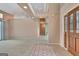 Spacious living room featuring high ceilings, neutral colors, and a doorway to another room at 316 Kensington Dr, Peachtree City, GA 30269