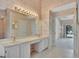 Bright main bathroom with dual sinks, and a doorway to the bedroom at 316 Kensington Dr, Peachtree City, GA 30269