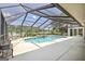 Inviting screened-in pool with spa and lounge area, perfect for outdoor enjoyment at 316 Kensington Dr, Peachtree City, GA 30269