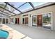 Enclosed back porch, leading to a pool, offers a relaxing space with views of the outdoors at 316 Kensington Dr, Peachtree City, GA 30269