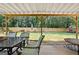 Backyard featuring a well-maintained lawn, fenced perimeter, and patio furniture at 9477 Forest Knoll Dr, Jonesboro, GA 30238