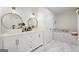 Luxurious primary bathroom featuring double sinks and a soaking tub at 9477 Forest Knoll Dr, Jonesboro, GA 30238