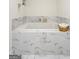 Inviting bathtub with elegant marble tile, ideal for relaxation at 9477 Forest Knoll Dr, Jonesboro, GA 30238
