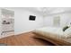 Comfortable bedroom with sleek flooring and stylish ceiling fan at 9477 Forest Knoll Dr, Jonesboro, GA 30238