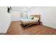 Spacious bedroom featuring hardwood floors and a modern ceiling fan at 9477 Forest Knoll Dr, Jonesboro, GA 30238