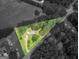 Aerial view of a homesite outlined in green, showcasing the property's boundaries at 1041 Sandy Ridge Rd, Mcdonough, GA 30252