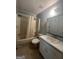 Bathroom featuring a sink and toilet next to the tub and shower area at 1041 Sandy Ridge Rd, Mcdonough, GA 30252